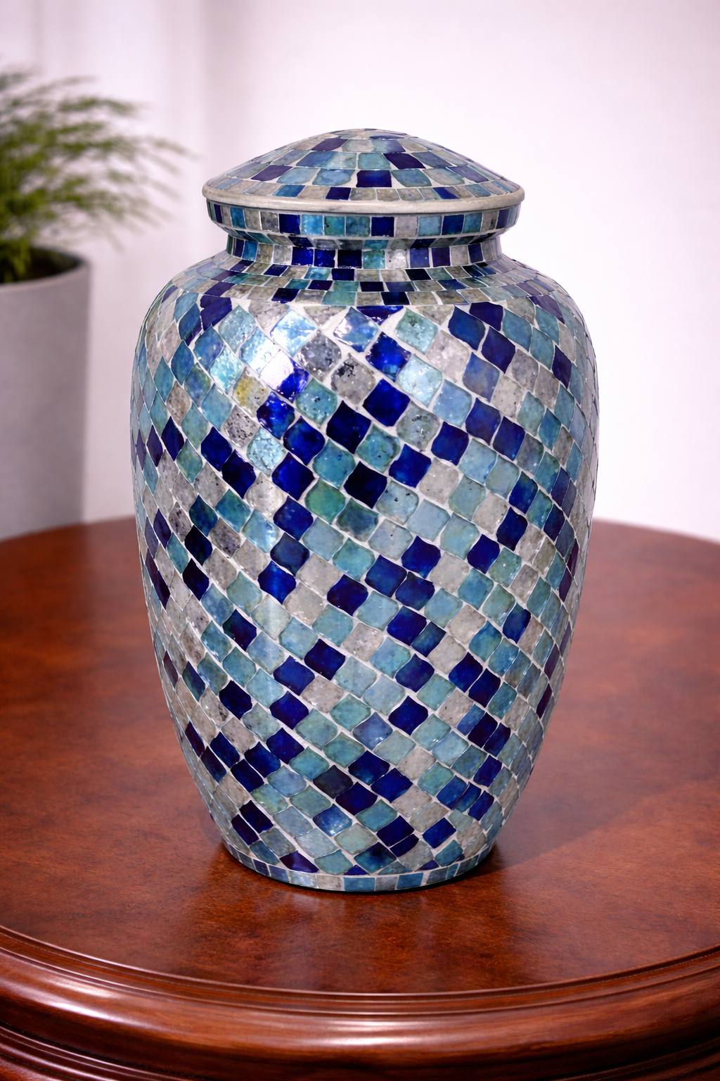 Handcrafted aluminium cremation urn with blue and aqua mosaic design