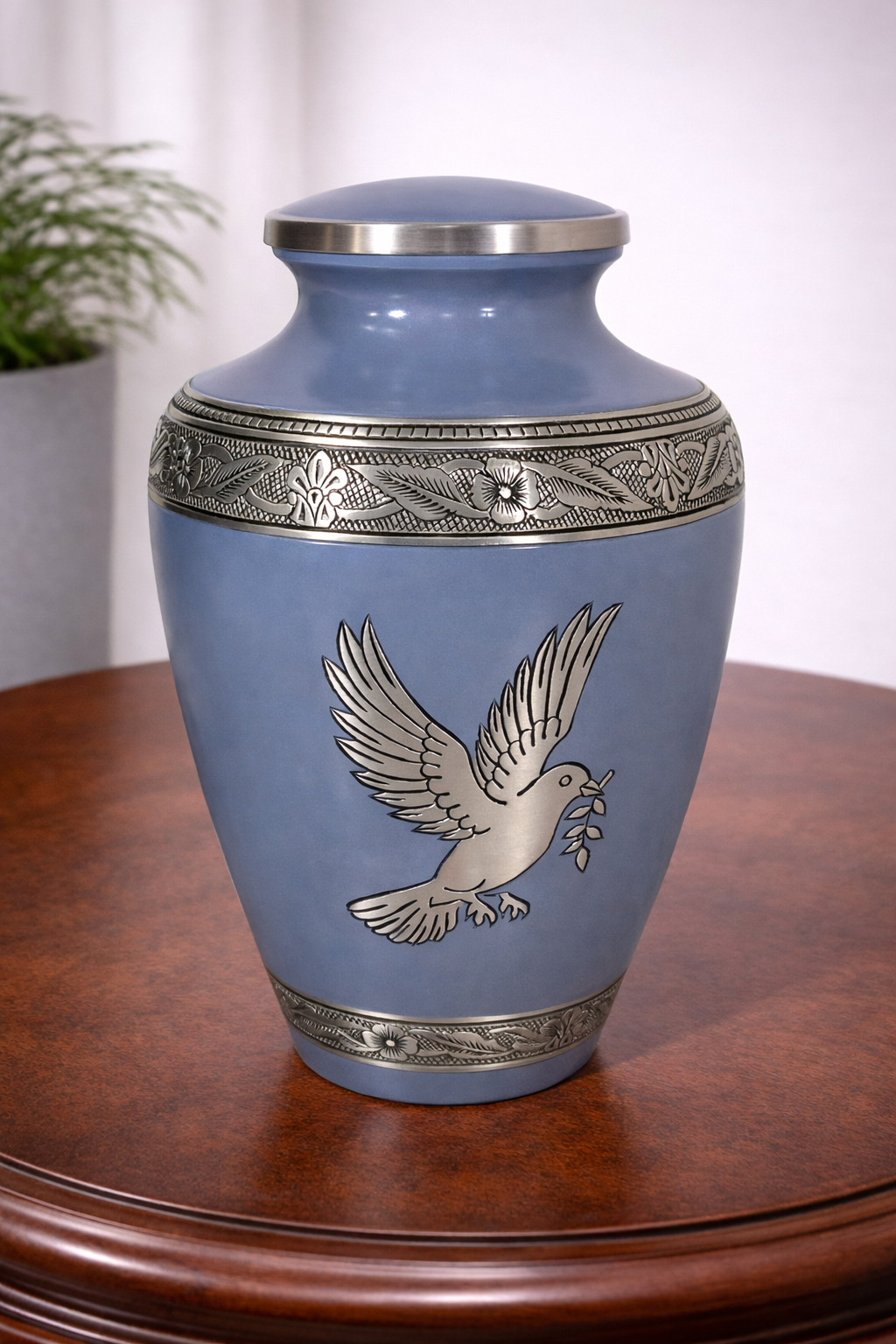Handcrafted blue aluminium cremation urn with silver dove motif