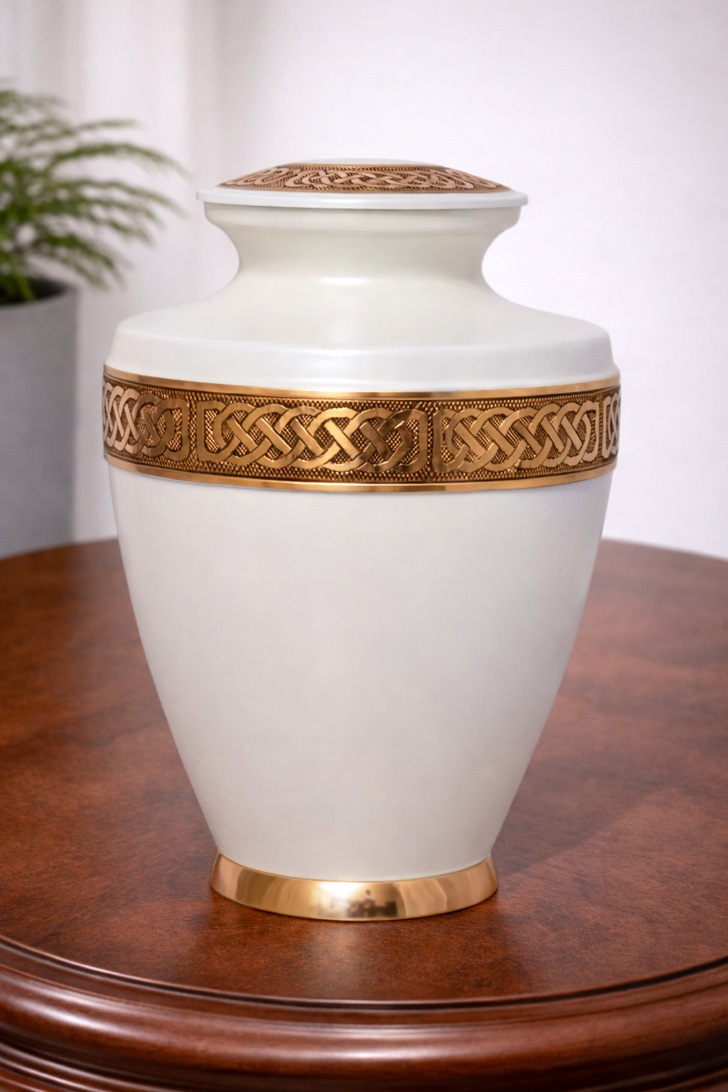 Elegant white aluminium cremation urn with gold Celtic band detailing
