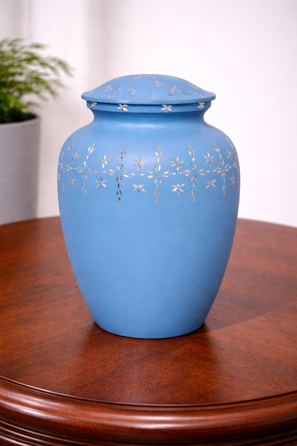 Handcrafted sky-blue aluminium cremation urn with delicate silver floral inlay