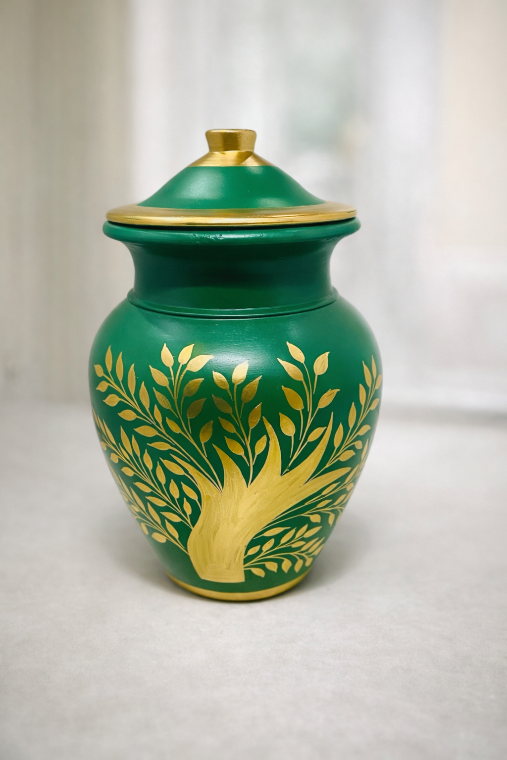 Elegant biodegradable cremation urn with green finish