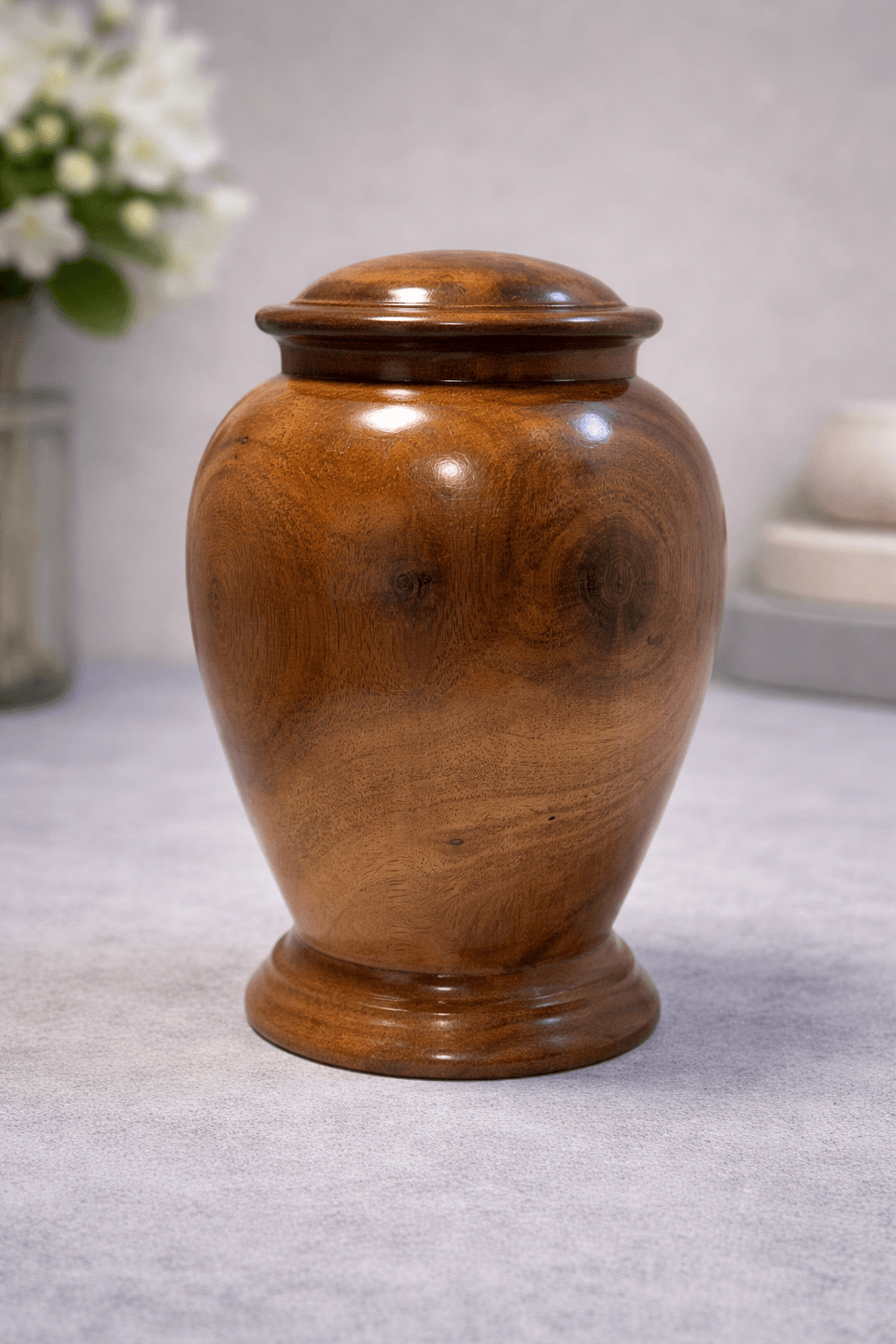 Classic handcrafted wooden urn with a smooth polished finish