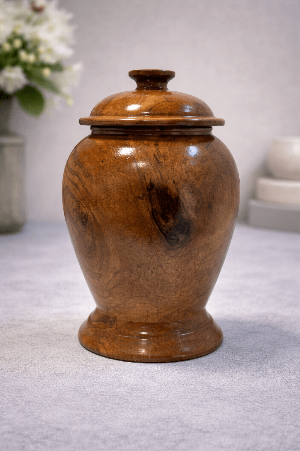 Elegant handcrafted wooden urn with a classic vase shape