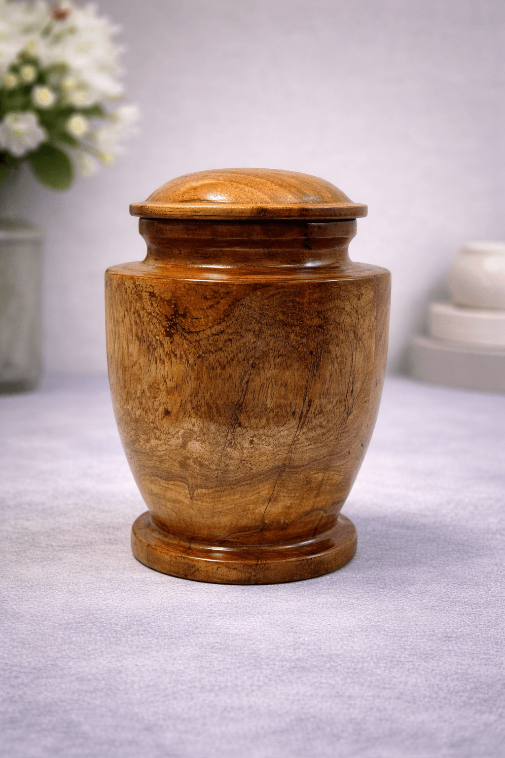 Elegant handcrafted wooden urn with natural grain finish and classic design