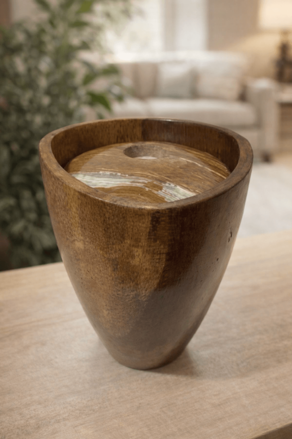 Contemporary handcrafted wooden urn with a tapered silhouette and natural grain finish