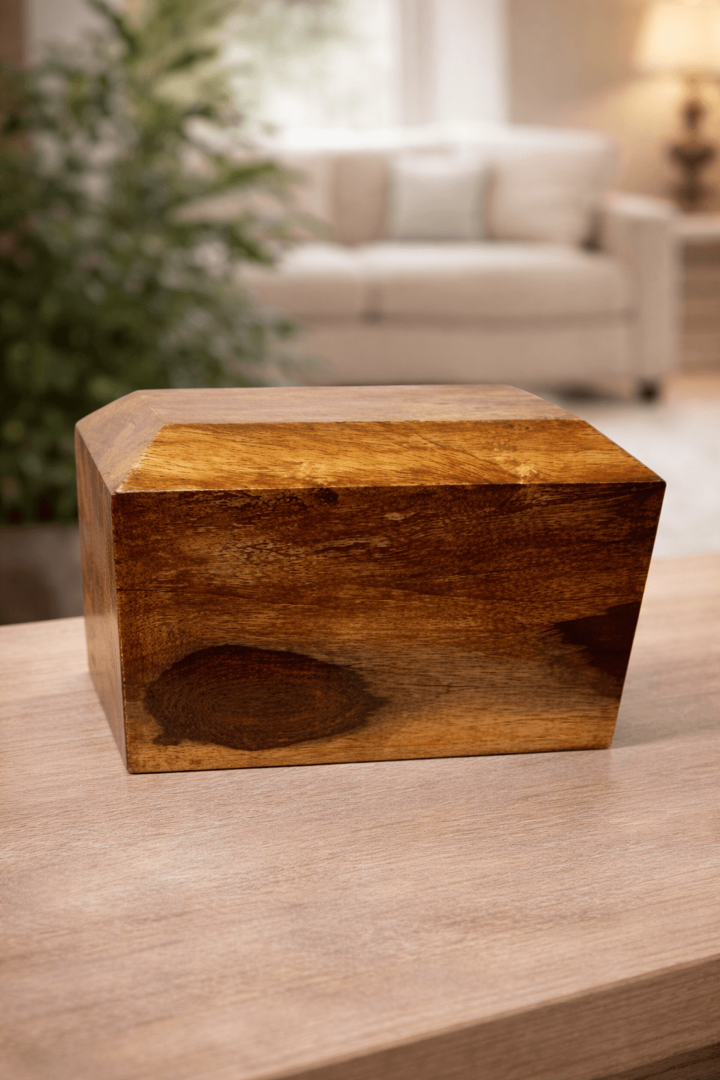 Handcrafted solid wooden urn box with a natural grain finish and sleek rectangular design