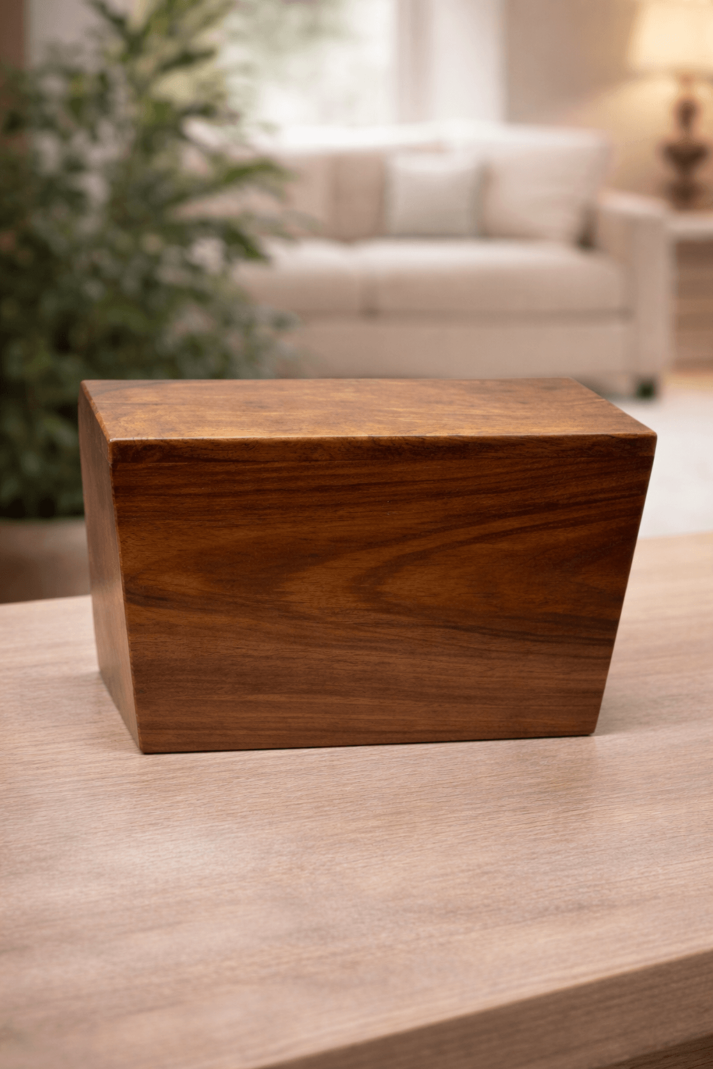 Elegant handcrafted solid wood urn box with a smooth natural grain finish