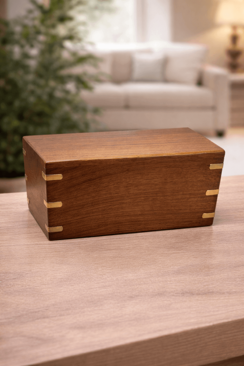 Premium handcrafted wooden urn box with elegant brass inlay accents and a smooth natural finish